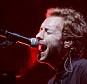 Britain's Chris Martin of Coldplay performs at Glastonbury music festival in Somerset in June 2005