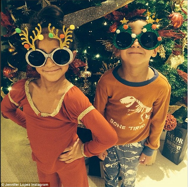 She didn't stay long: It was also reported the I Luh Ya Papi singer raced back to the US after the alleged concert to spent Thanksgiving with her twins Max and Emme, aged six; here they are pictured by their Christmas tree over the weekend