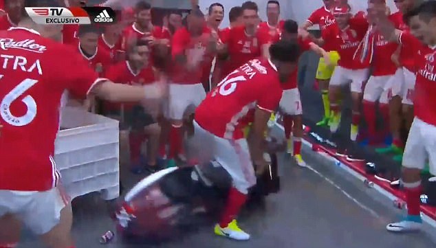 Benfica winger Eliseu Pereira dos Santos spun around on a moped in the team's dressing room after they won this year's domestic Primeira Liga title