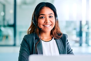 A young Dell Tech Advisor who is ready to answer the phone and help a customer.