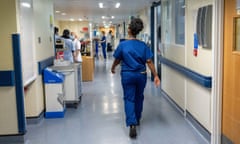 NHS staff work in a hospital ward in England