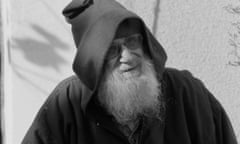 A black and white photo of Alexander Grothendieck wearing a hooded cloak and dark glasses, and with a long grey beard