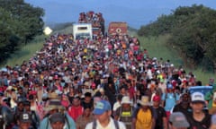 Central American and Haitian migrants and asylum seekers in Mexico walk towards the US border