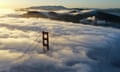 a bridge is shrouded in fog