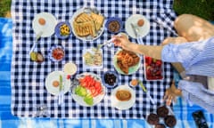 Picnic setting on a blue checkered tablecloth