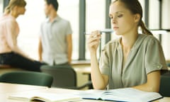 Young woman studying in university library<br>AH08CT Young woman studying in university library