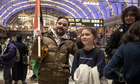 Greta Thunberg, right, at a demonstration in Stockholm, Sweden, against Israeli attacks on Gaza, 24 November.