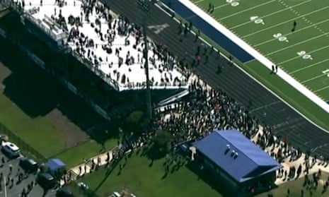 Aerial video shows evacuated students in football field after school shooting in Georgia – video