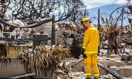 firefighter surveying fire damage