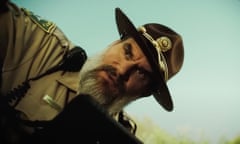 a still from an ad of a country sheriff