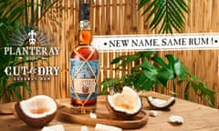 An ad showing a bottle of Planteray Rum on a table with open coconuts next to it and plants in the background