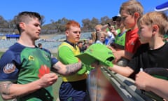 John Bateman signs autographs for his new public after a Canberra Raiders training session.