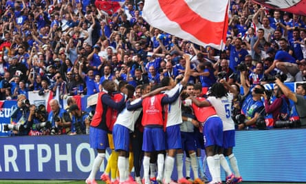 France players celebrate in front of their supporters after taking the lead against Belgium.