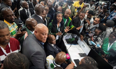 Jacob Zuma is surrounded by people at the elections result centre on Saturday