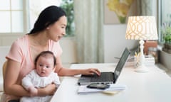 Asian mother with baby working from home<br>EB3C5B Asian mother with baby working from home