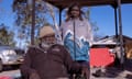 Jack Cool with his daughter Petrina at Walpriri town camp in Alice Springs. Jack has had to travel back and forth from Laramba in order to see his family due to kidney disease. Photograph: Isabella Moore/The Guardian