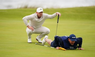 Matt Wallace and his caddie line up a shot