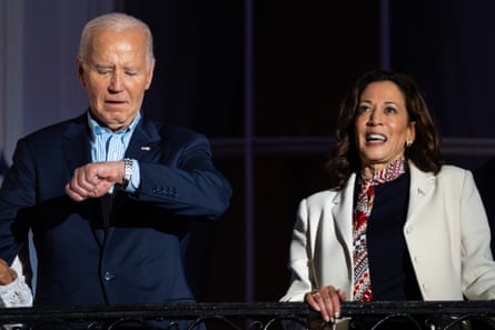 a man looks at his watch while a woman looks ahead