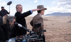 Explosive talent … director Christopher Nolan, centre, and Cillian Murphy, right, during the making of Oppenheimer.