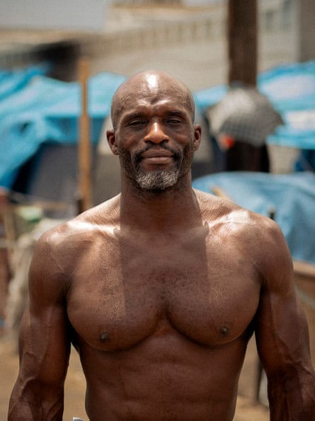 Michael Shaw lives at an encampment in Phoenix where residents are grappling with daily temperatures of 110F and above.