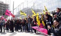 French trade unions demonstrate outside a Paris courthouse as the trial of the executives begins.