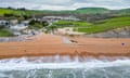 An aerial view of waves hitting the beach at Seatown in Dorset