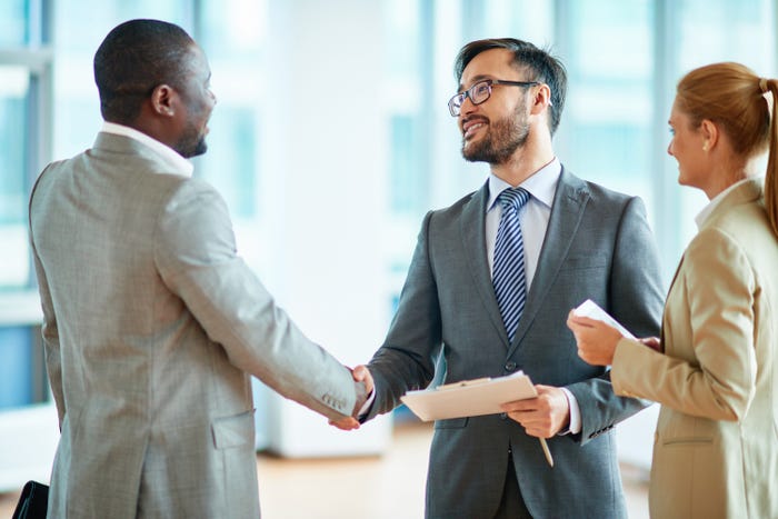 handshake job interview happy