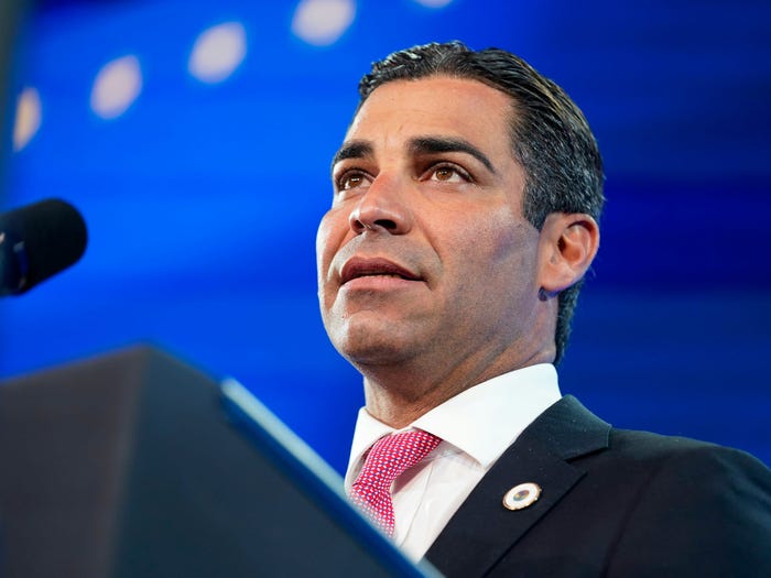 Mayor of Miami Francis Suarez, and president of US Conference of Mayors introduces President Joe Biden to speak at the U.S. Conference of Mayors' 90th Annual Winter Meeting at the Capitol Hilton in Washington, Friday, Jan. 21, 2022.