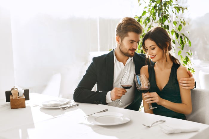 A man and woman on a date in a restaurant