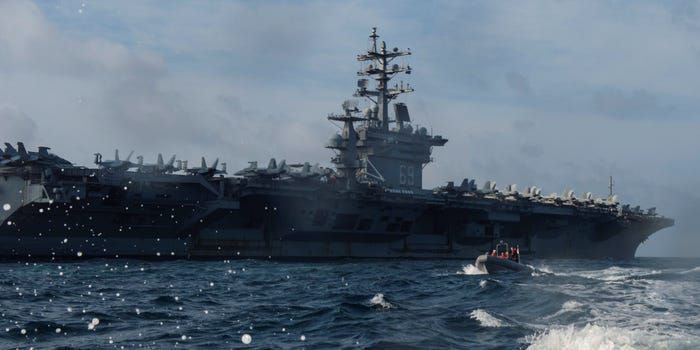 Personnel assigned to the U.S. Navy aircraft carrier USS Dwight D. Eisenhower conduct small boat operations during a training exercise in the Arabian Sea April 17, 2020.