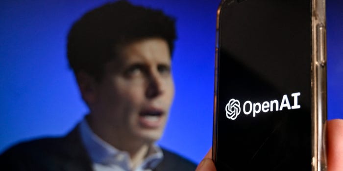 OpenAI logo on a phone with CEO Sam Altman in the background