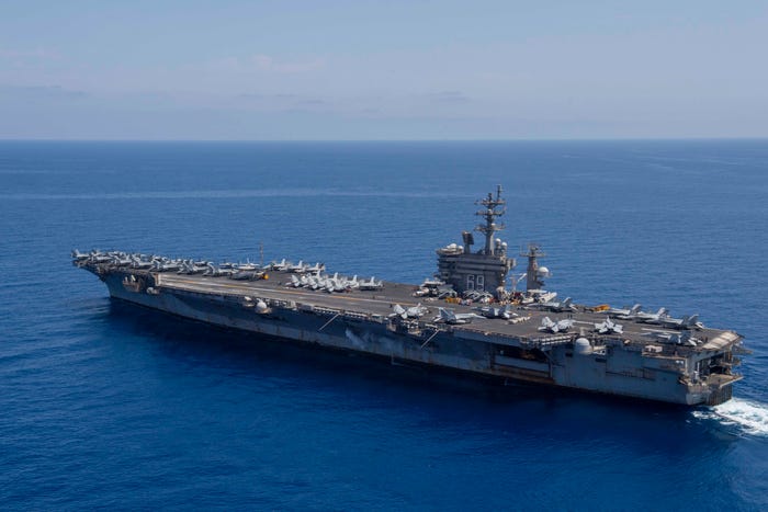 The Nimitz-class aircraft carrier USS Dwight D. Eisenhower and the French aircraft carrier FS Charles De Gaulle participate in a photo exercise in the Mediterranean Sea on May 2.