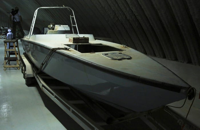 FILE - In this June 19, 2018 file photo, a boat that officials described as being a "drone boat" once loaded with explosives by Shiite rebels in Yemen, is on display at a military installation in the United Arab Emirates.