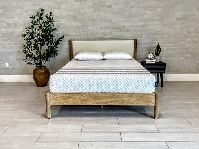 The Leesa Sapira Hybrid Mattress is displayed in a bedroom.