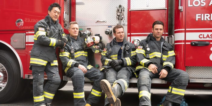 Kenneth Choi, Peter Krause, Oliver Stark, and Ryan Guzman wear firefighter uniforms on the set of ABC's "9-1-1."