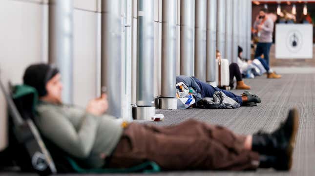 Travelers wait out a snowstorm at Denver International Airport