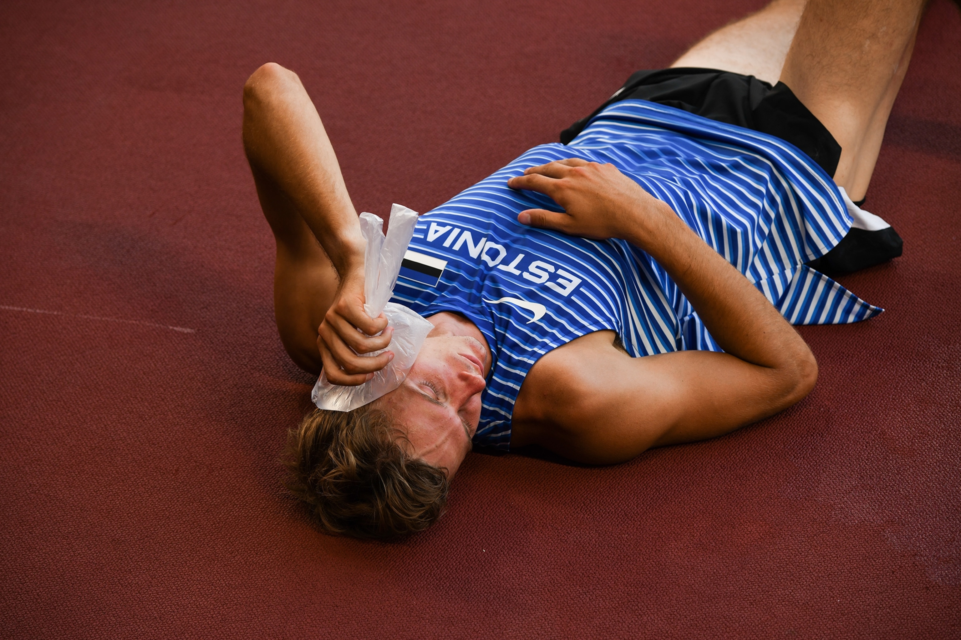 An athlete cools off with a bag of ice during the Tokyo 2020 Olympic Games.