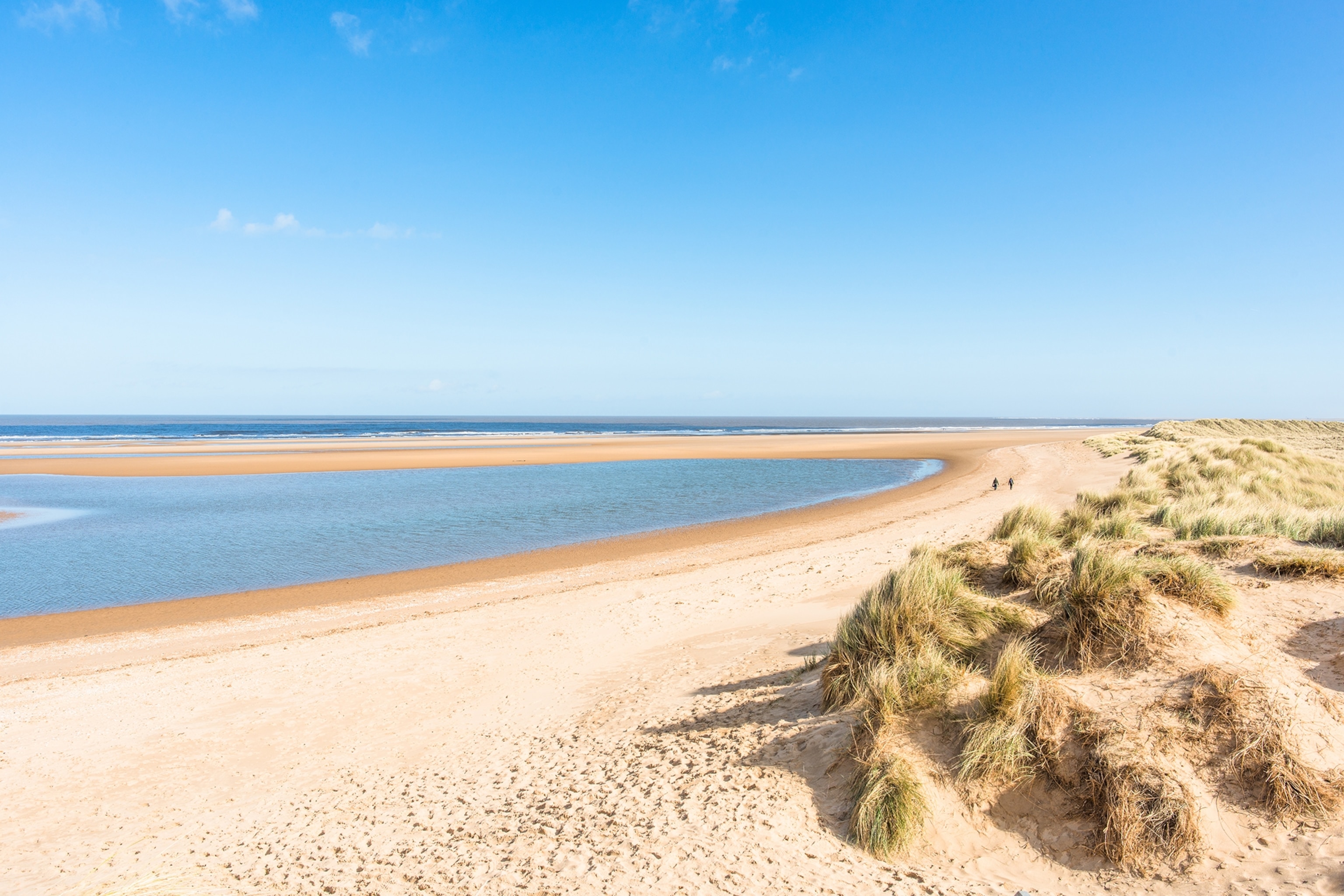 Sand dunes where Norfolk Coast path National Trail from Burnham Overy Staithe reaches the sea, East Anglia, England, UK.