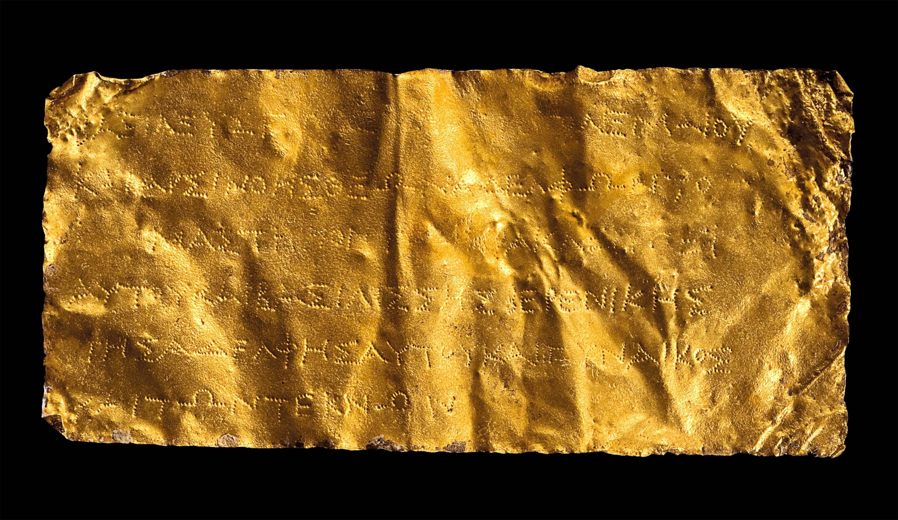 A gold plaque that bears the name Ptolemy III