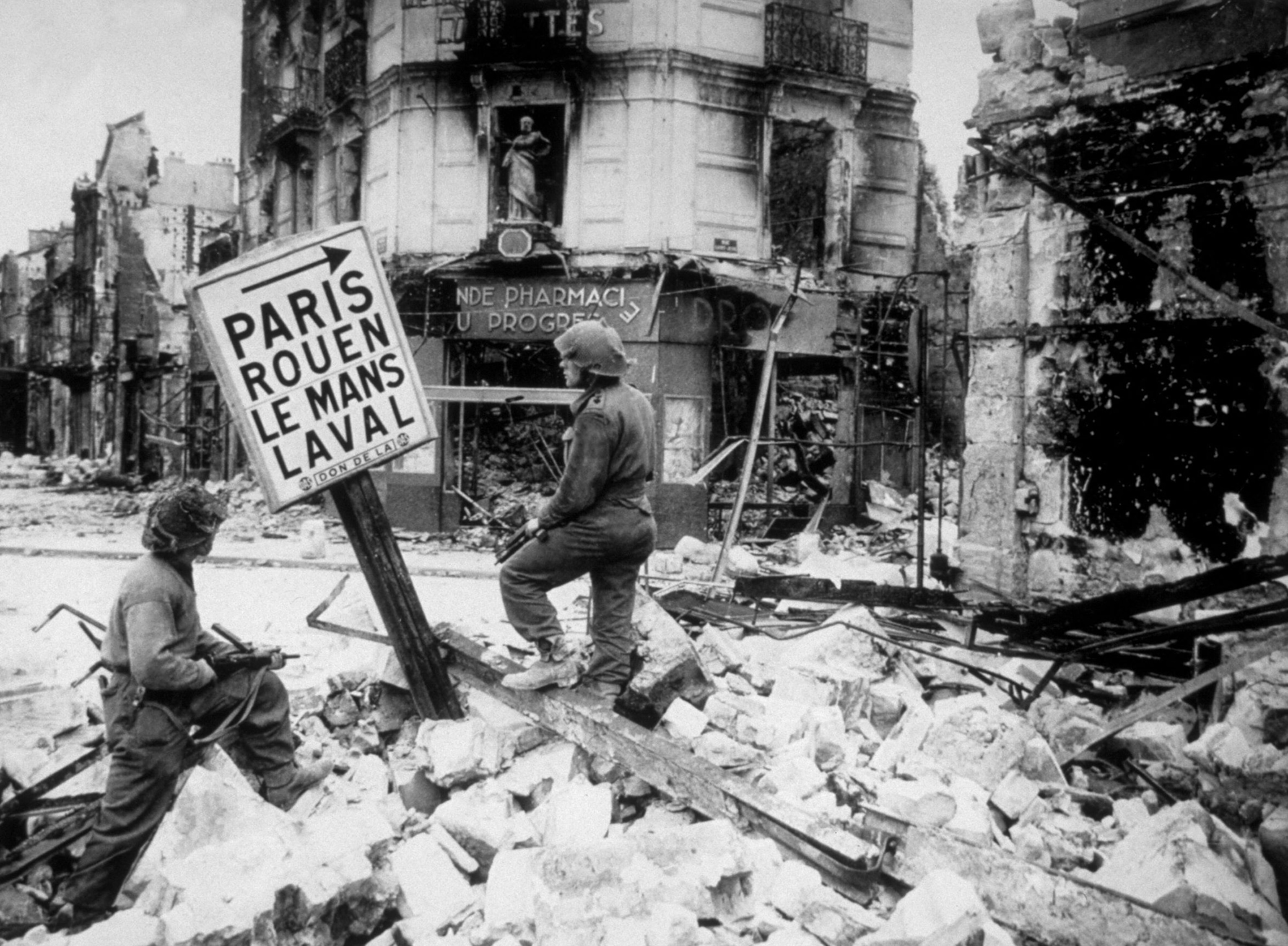 Black and white image of Paris surrounded by rubble.