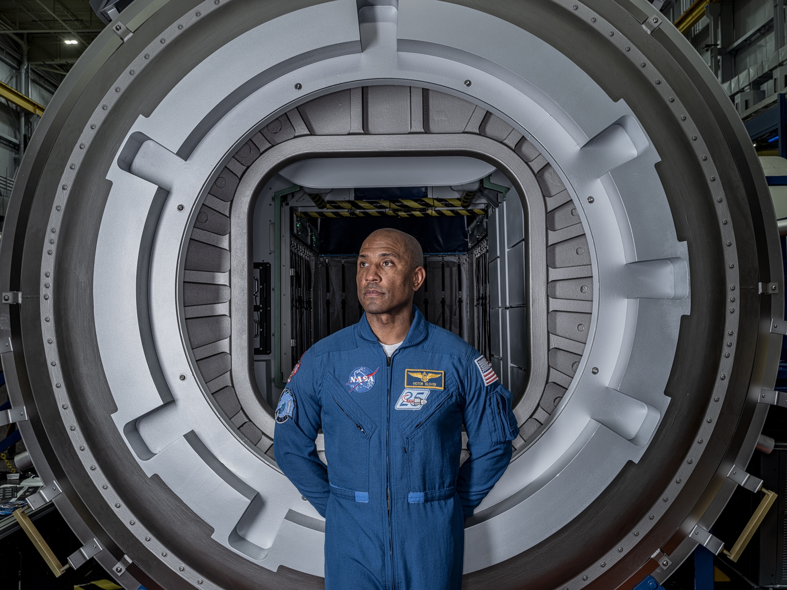 Man in blue NASA uniform.