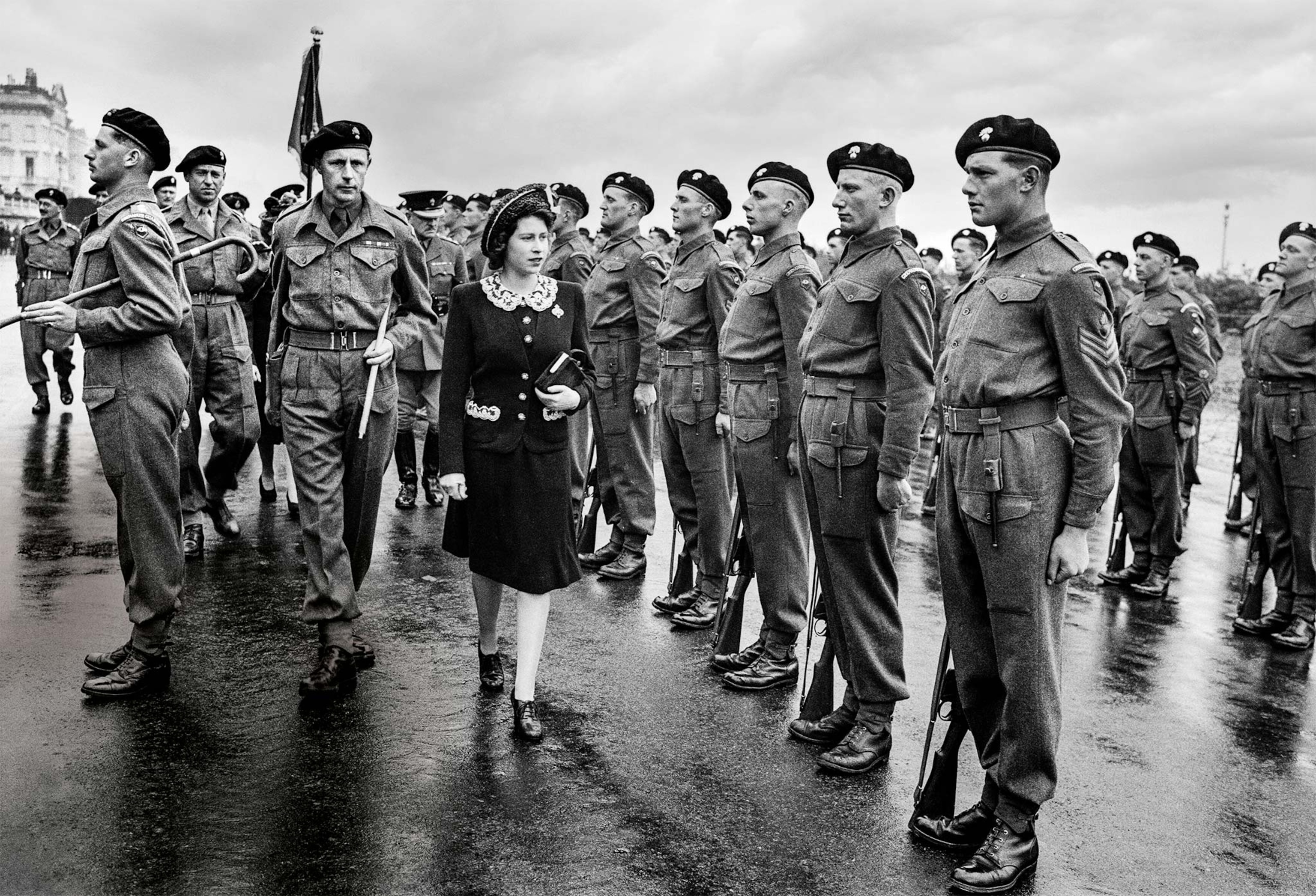 18-year-old Princess Elizabeth, the future queen, inspects an honor guard of the Second Battalion Grenadier Guards on May 17, 1944, during D-Day preparations.