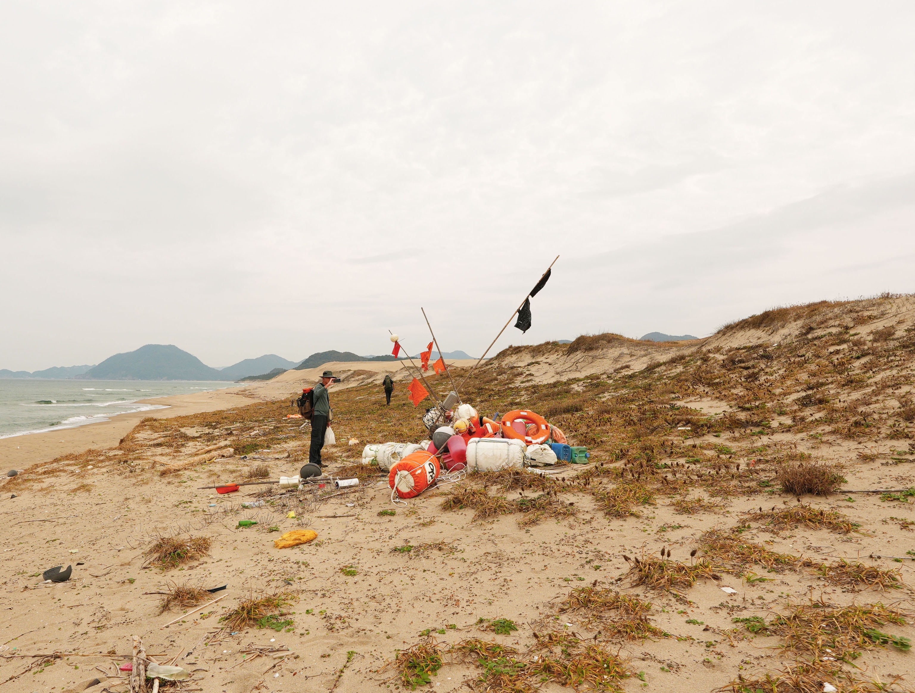 Salopek photographs a plastic sculpture formed by random washed up de bris on Hakuto beach in Tottori, Japan.