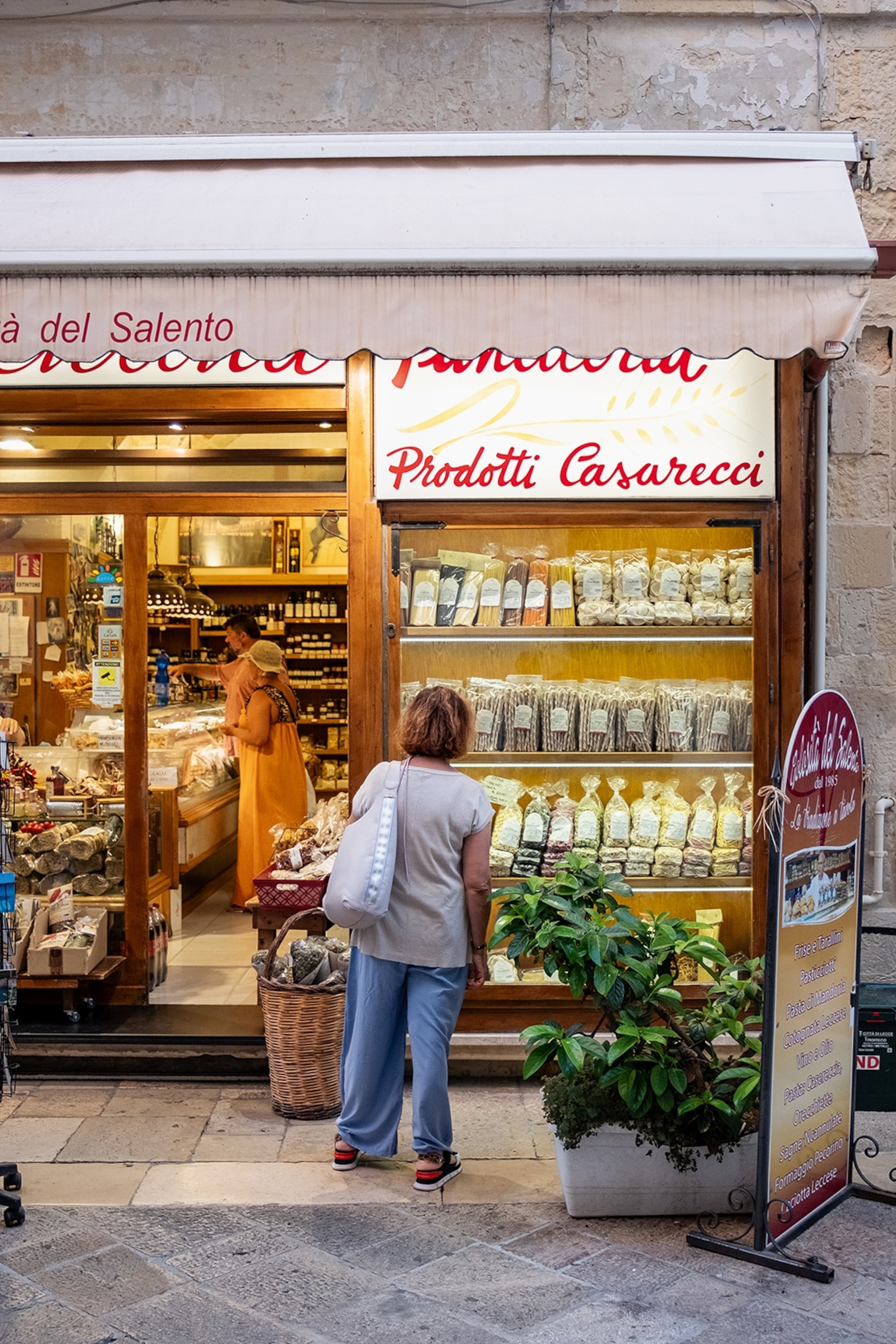 Woman standing outside a shop