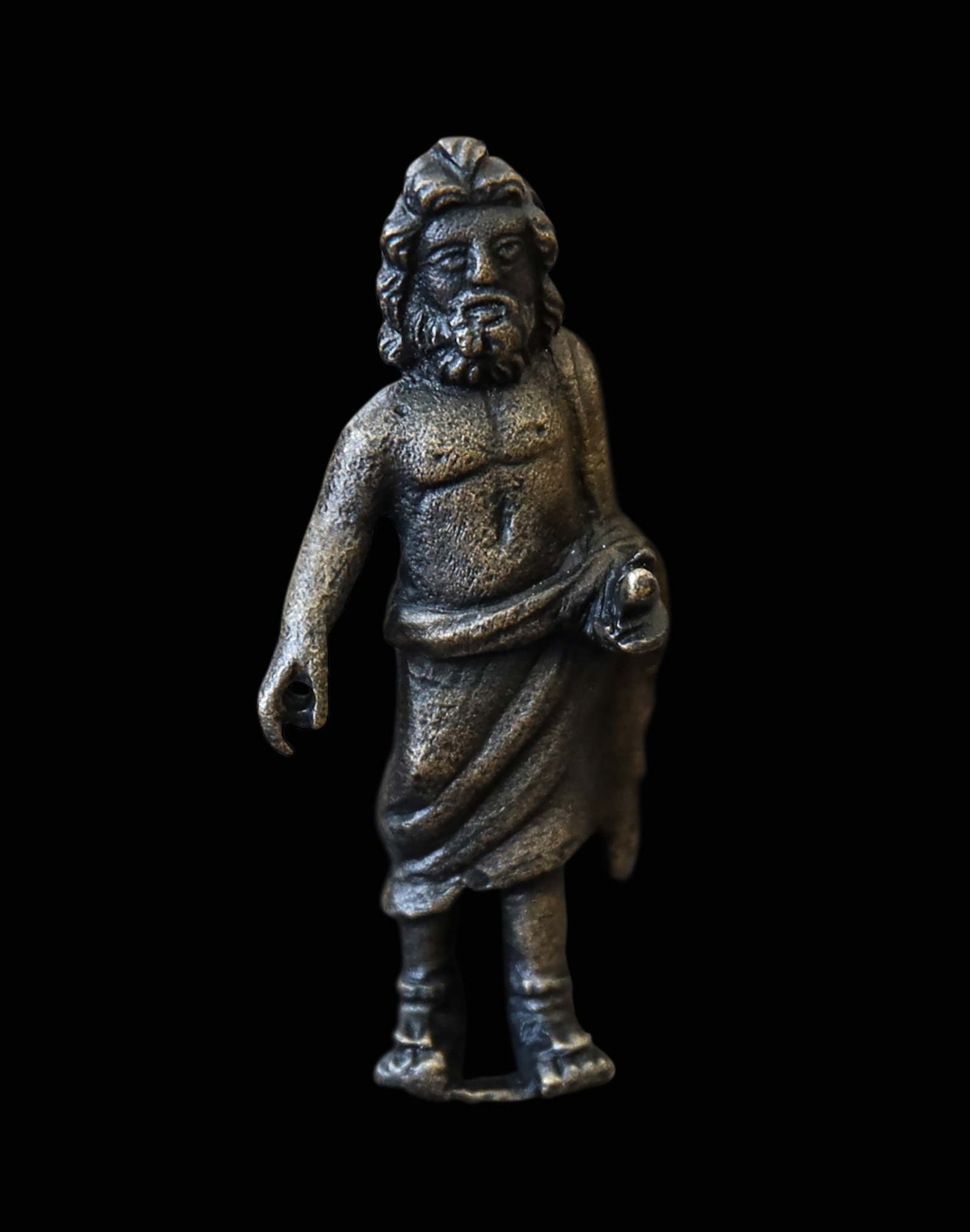 A bronze statuette of a man in a toga