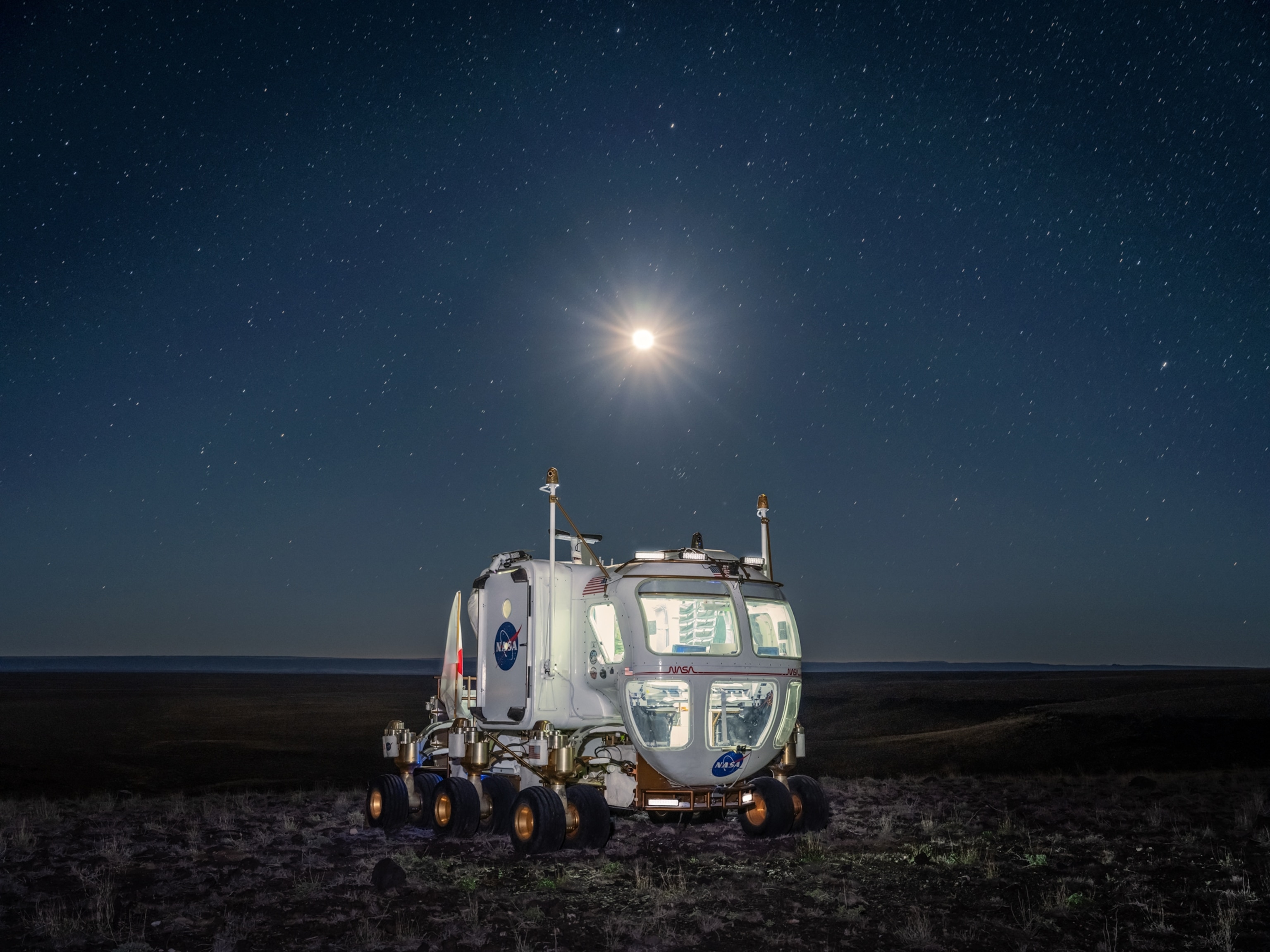 Rover photographed in the field at night under starry skies.