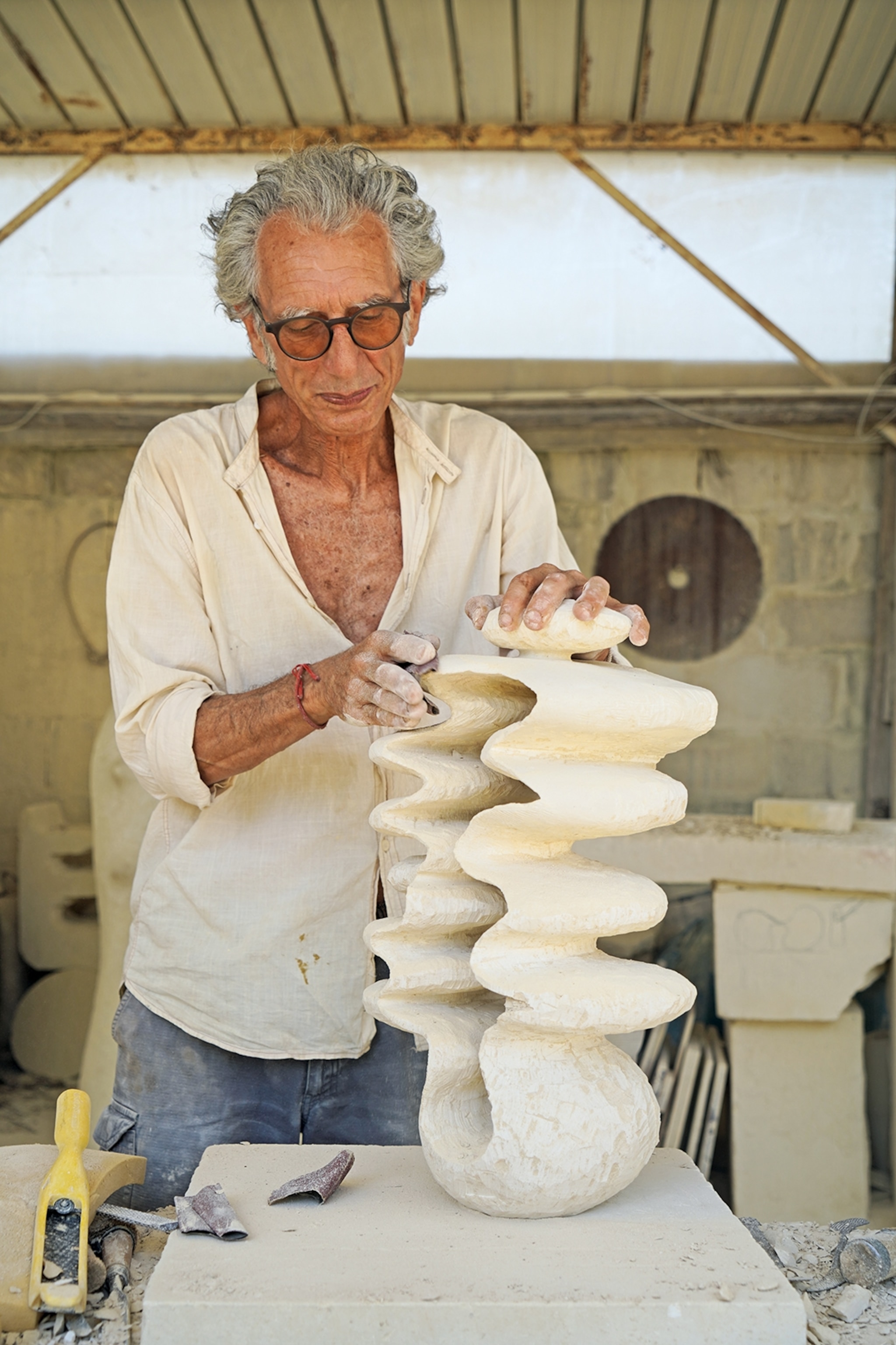 Man scultpting an artefact