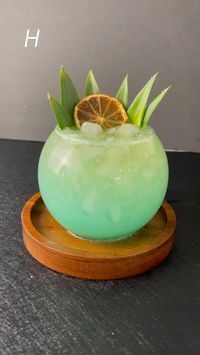 5min · 1 serving     Ingredients   • 2 oz Vodka   • 2 oz Apple Liqueur   • 1 oz Fresh Lemon   • 2 oz Pineapple Juice  • 1/4 oz Blue Curaçao  • 1/4 oz Coconut Milk