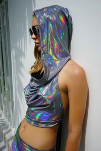 The Layla cowl neck crop top is super holographalistik expialidocious! No filter necessary to shine like a rainbow in this holographic rave top. FEATURES: Cowl Neck Hooded Crop top length Halter style with adjustable tie back Sheer proof Made with high quality holographic nylon spandex Ethically made and 100% carbon neutral FIT NOTES:Because of the adjustable tie at back the sizing is super flexible and fits a range of body shapes and sizes.Model is 5'10'' and wears size S/M Pair with the matchi