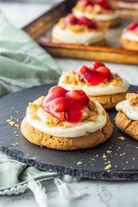 Cherry Cheesecake Cookies are Crumbl Copycat New York Cheesecake Cookies with cream cheese frosting, buttery streusel, and juicy cherry topping!